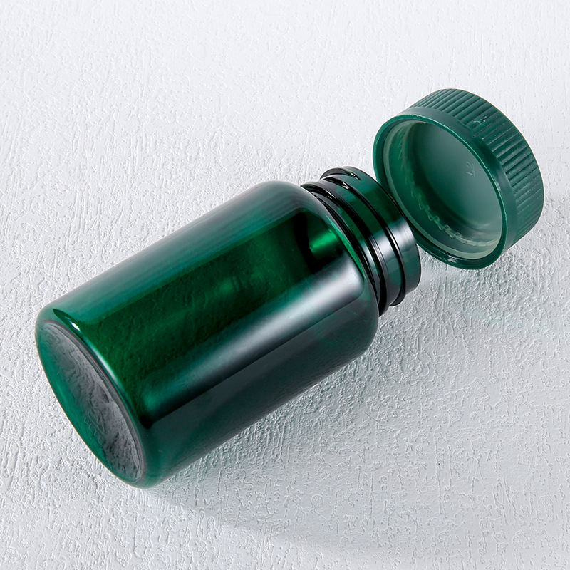 Botella de plástico verde con tapa de tornillo botella vacía botella de productos de salud botella de cápsula botella de grado alimenticio botella dividida