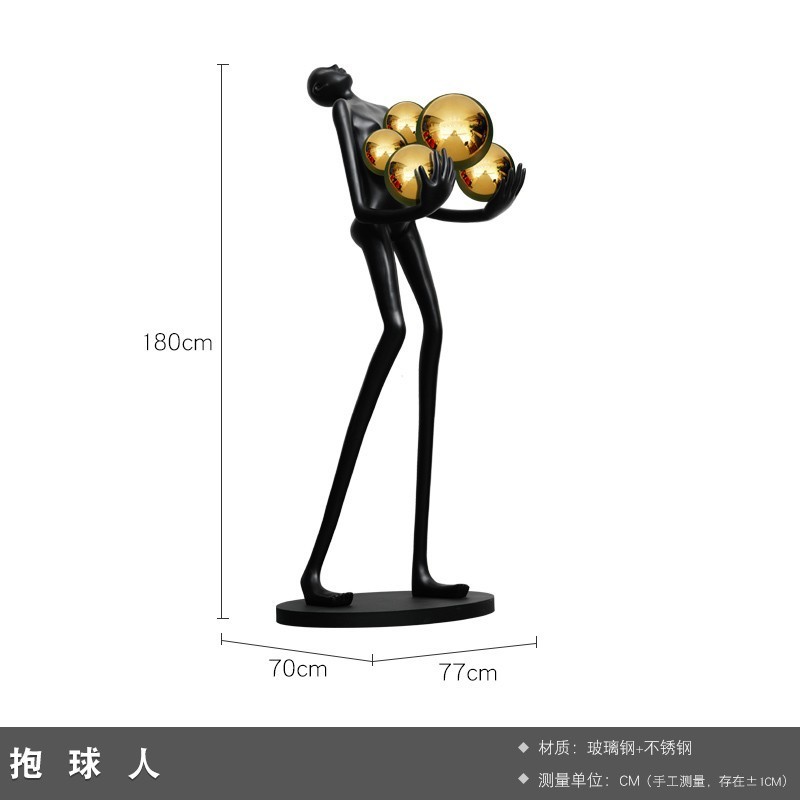 現代の抽象芸術はボールの人物の彫刻を抱きます。|undefined