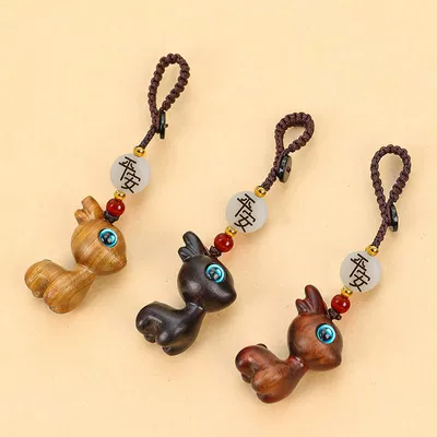 A deer car key chain pendant sandalwood deer buckle key car decoration deer couple pendant