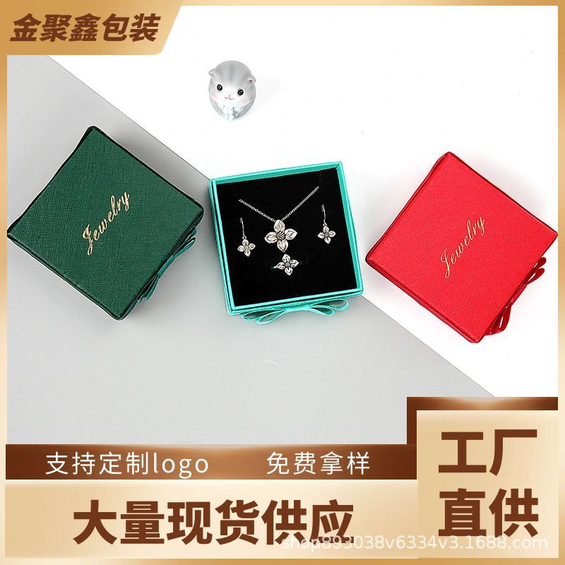 Inventario al por mayor arco cinta joyería embalaje de joyería caja de cartón simple anillo collar caja de regalo