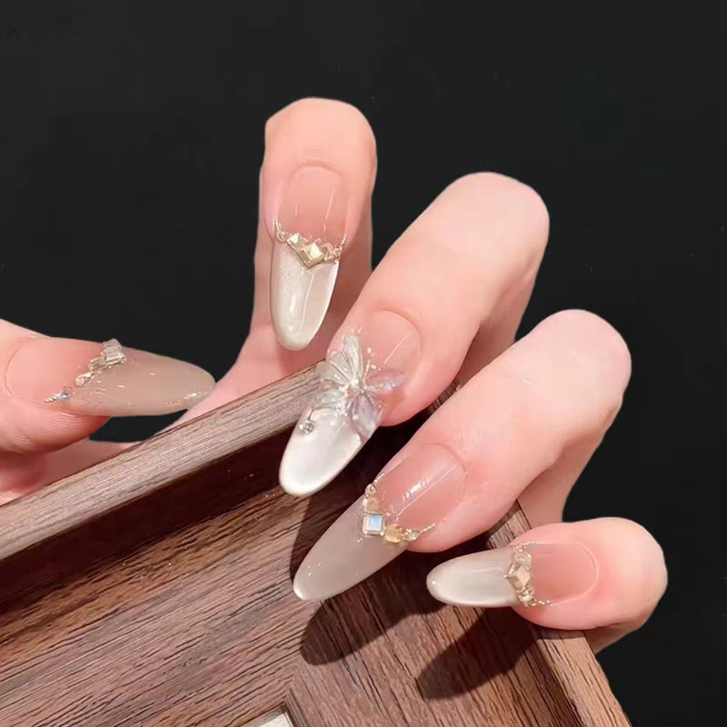 10-Piece Set of Handmade Nail Art with a French-Style Cat-Eye Design Featuring Sparkling Three-Dimensional Butterflies, Suitable for Fair Skin Tone 10-Piece Set of Handmade Nail Art with a French-Style Cat-Eye Design Featuring Sparkling Three-Dimensional Butterflies, Suitable for Fair Skin Tone