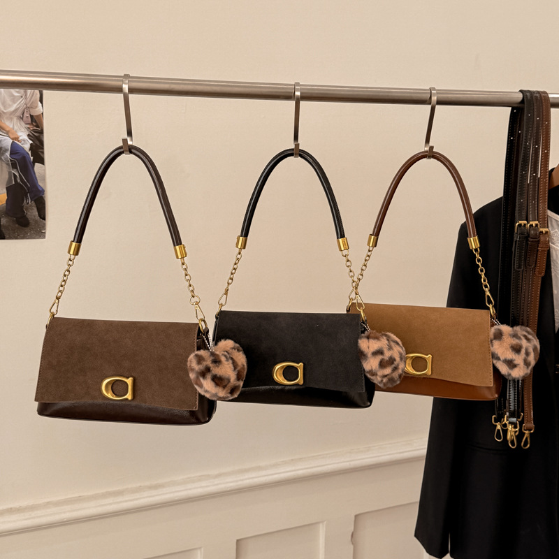 2025 invierno nuevo estilo extranjero transfronterizo bolsas de palo, bolsas de estilo retro con tapa de hombro inclinada, bolsas inferiores
