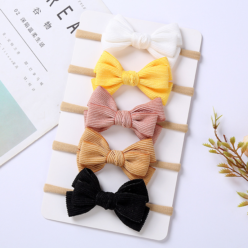 Brand children's hair accessory with bow