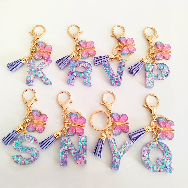 New Light Purple Mixed Color Glitter English Letter Resin Key Pendant Fashion Simple Butterfly Tassel Bag Pendant New Light Purple Mixed Color Glitter English Letter Resin Key Pendant Fashion Simple Butterfly Tassel Bag Pendant