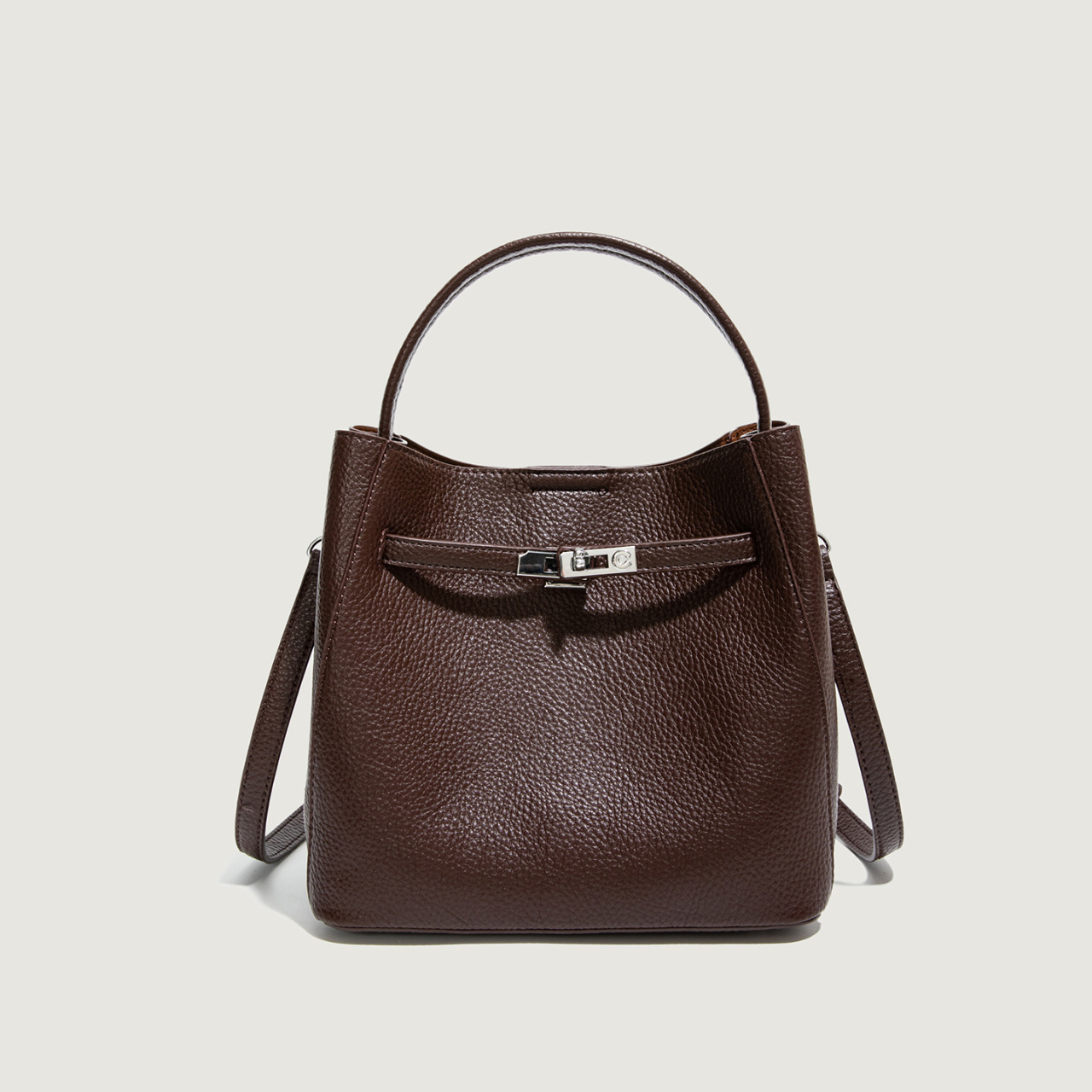 Bolso coreano de cuero suave litchi de gran capacidad de un solo hombro bolso de cubo 2025 nuevo bolso de cinturón de bloqueo para mujeres