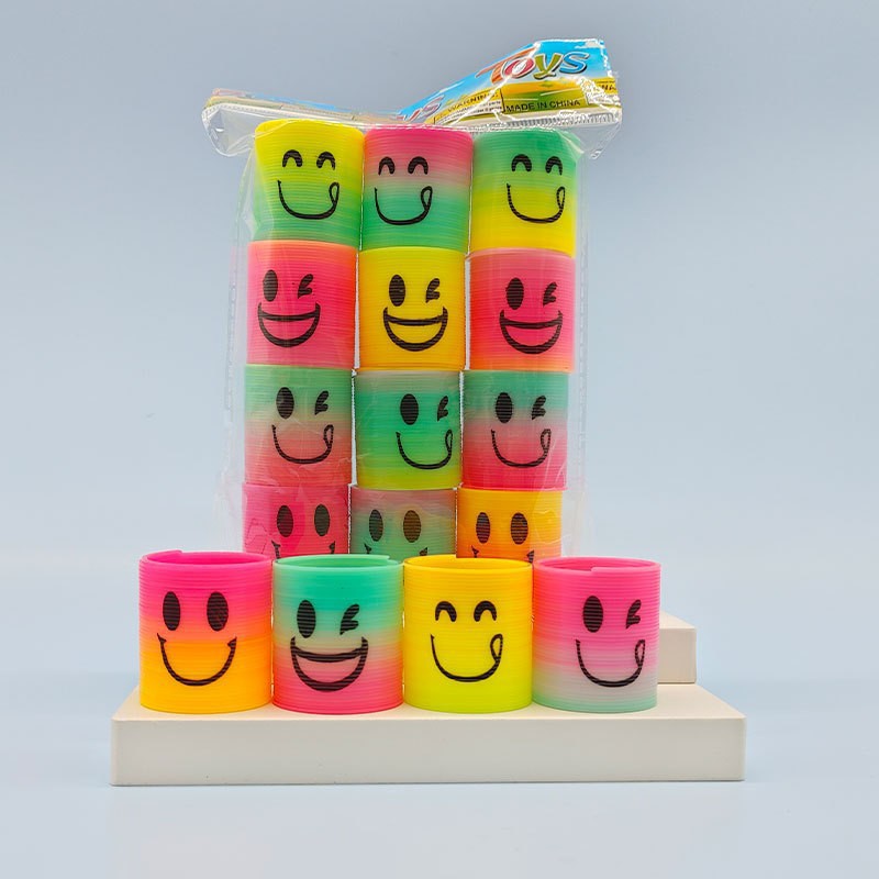 Regalo de trompeta de anillo de primavera de venta caliente transfronteriza, rompecabezas, nostalgia, sonrisas sonrientes apiladas, música mágica círculo del arco iris