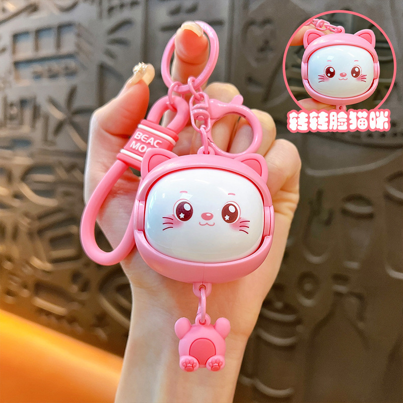 Llavero creativo de dibujos animados girando música lindo descompresión cambio de cara llavero de gato bolsos para hombres y mujeres pequeños regalos al por mayor