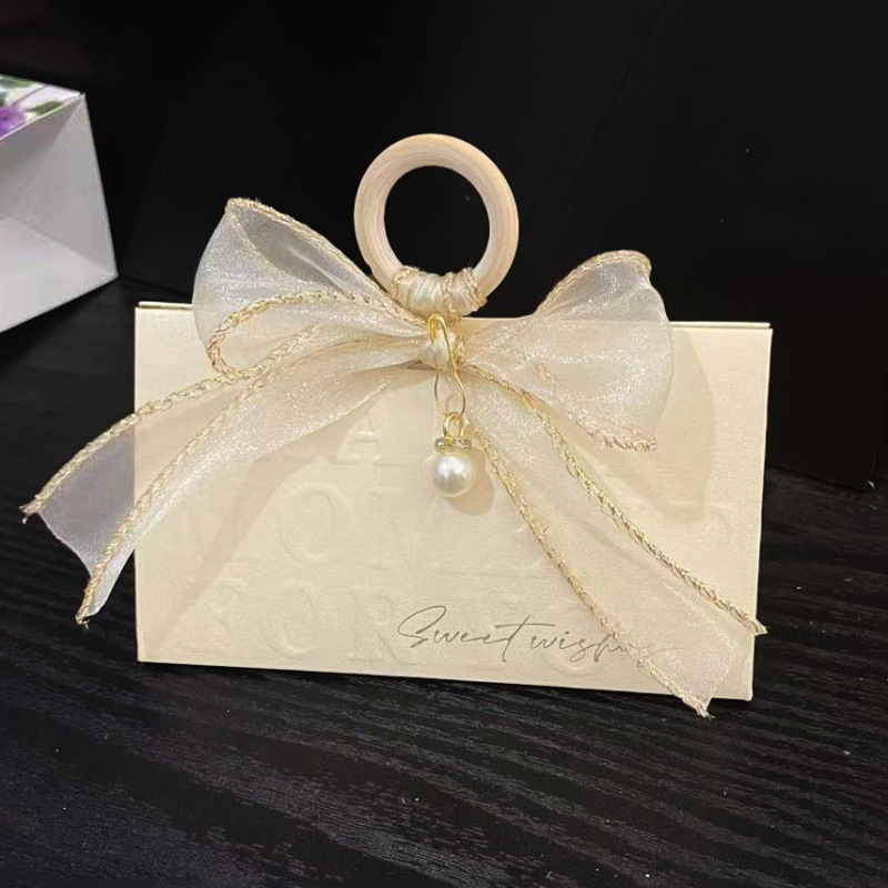 クリエイティブシャンパン色の手提げ婚約結婚結婚式の三角喜糖箱木環お土産魚尾紗喜糖箱|undefined