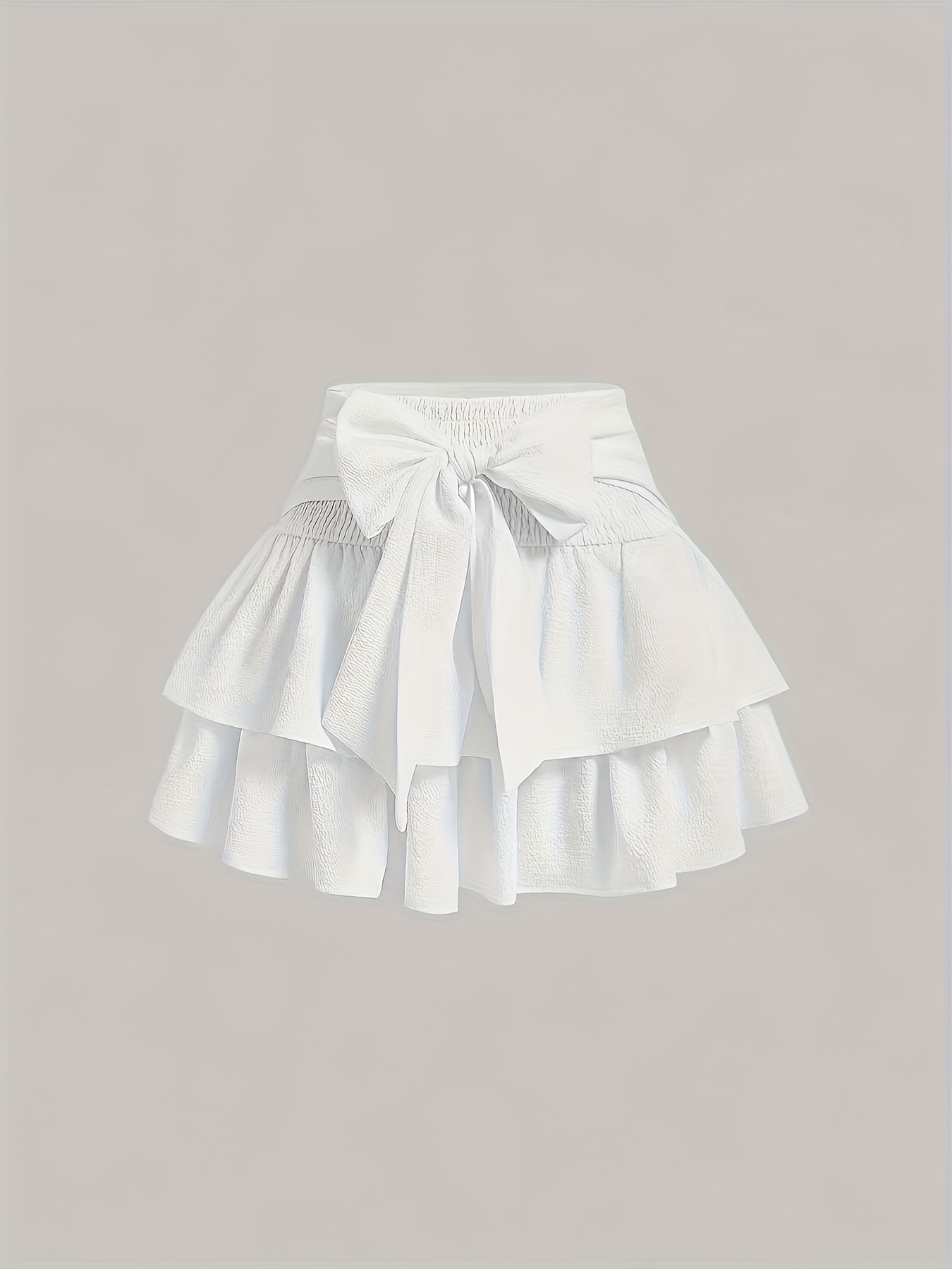 Stylish in layered ruffle mini skirt with bow design perfect for all…
