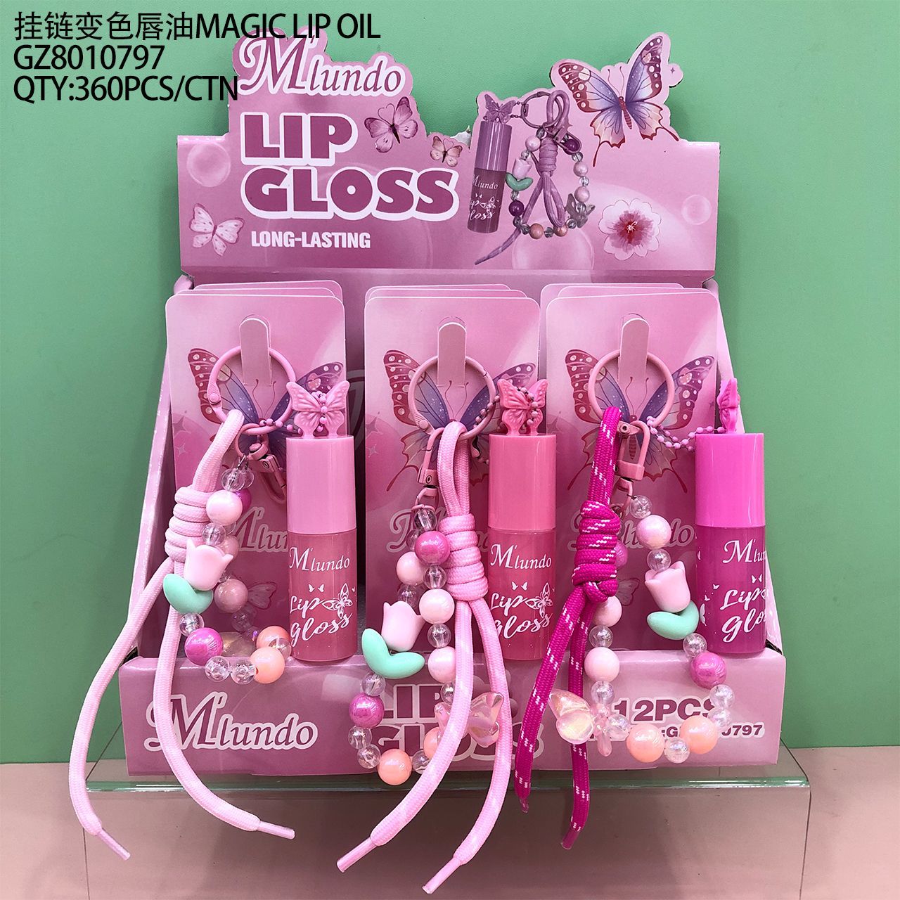 Nuevo producto Mlundo, set de aceite labial con cadena colgante y lámina dorada que cambia de color, hidratante, maquillaje hermoso y moderno, venta al por mayor del fabricante.