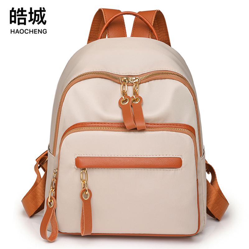 Bolsos para mujer 2023 nueva mochila de nylon para mujer coreana moda contraste color al aire libre mochila de viaje ligera al por mayor