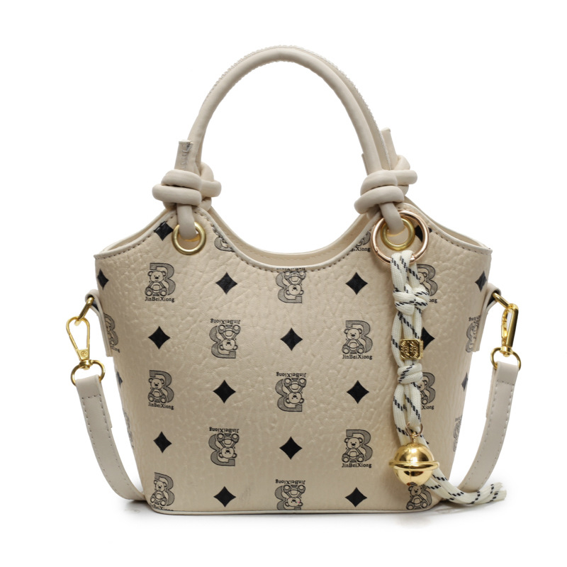 Tendencia impresa bolso de cubo de mano mujer 2025 nueva moda textura versátil bolso de hombro super caliente bolso de mochila