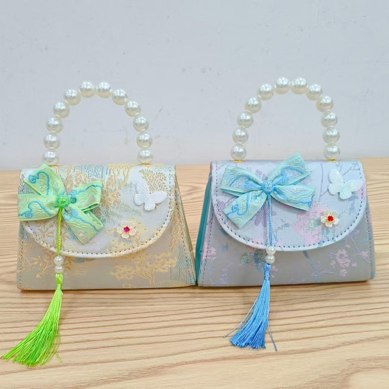 202 nuevo arco de estilo nacional bolsos para niños pequeños bolsos de moda de perlas de moda princesa bolsos de mano inclinados