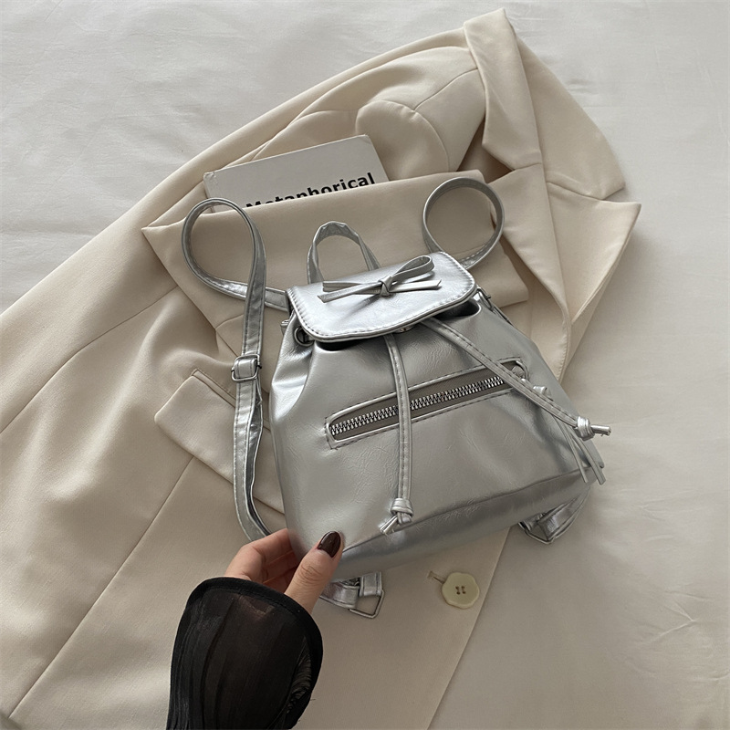 Mochila de nicho coreana para mujer, verano 2024, nueva mochila de moda, bolso de cubo portátil de un solo hombro de todo fósforo