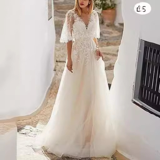 Vestido de noiva etéreo de manga comprida com decote em v_voghion.com