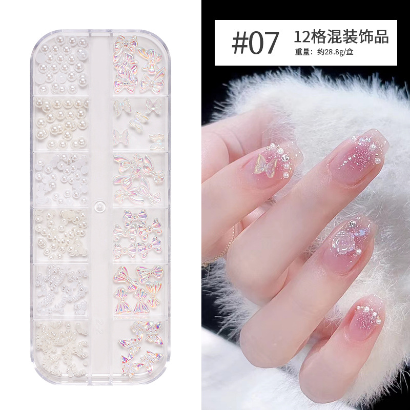 Joyería de uñas Aurora arco perla remache pequeños accesorios Super Flash pequeño diamante 12 rejilla mixta decoración de uñas al por mayor
