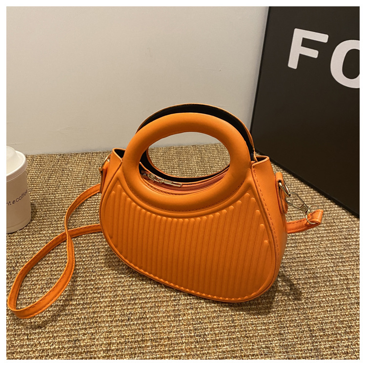 Fresco dulce dopamina color sólido rayas bolso de las mujeres este año popular pu estilo occidental bolso de hombro redondo