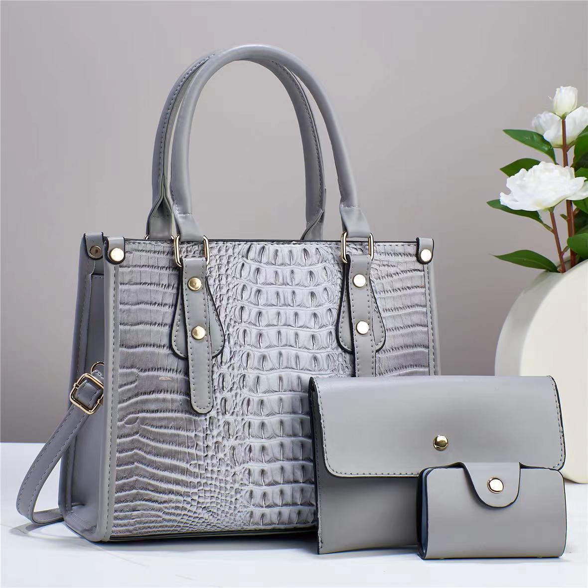 Bolso de mujer de moda popular 2026 nuevo transfronterizo de tres piezas europeas y estadounidenses paquete de bolso de madre para mujeres de viaje universal mochila de hombro