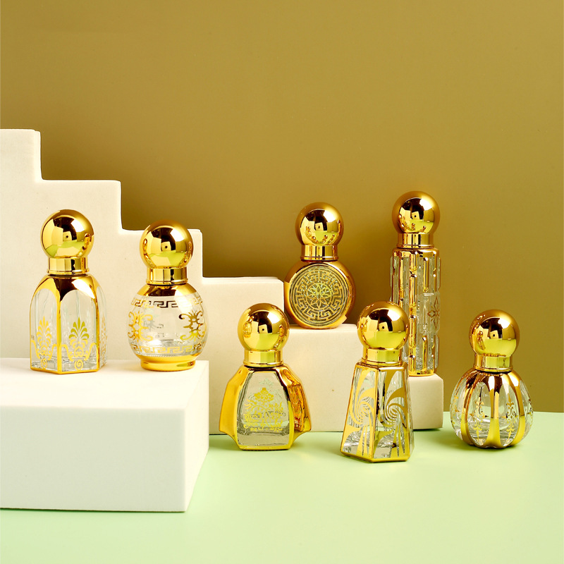 Medio Oriente vidrio esencial aceite rodillo bola botella metal transparente perfume sub-botella de galvanoplastia artesanía fábrica al por mayor