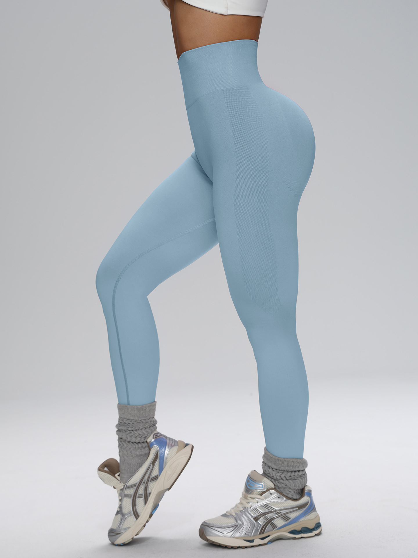 Europa y los Estados Unidos sin costuras cintura alta pantalon de gimnasio de alta cadera para mujeres corriendo al aire libre apertado nueve pantalones de pelusa de miel