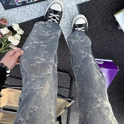 American-style high-street vibe camo tie-dye denim jeans for men: loose-fit, casual, washed-out look with dramatic ink-splashed, vintage-inspired drop-crotch design.