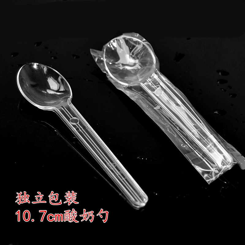 Transparent disposable plastic spoon for ice cream, mousse