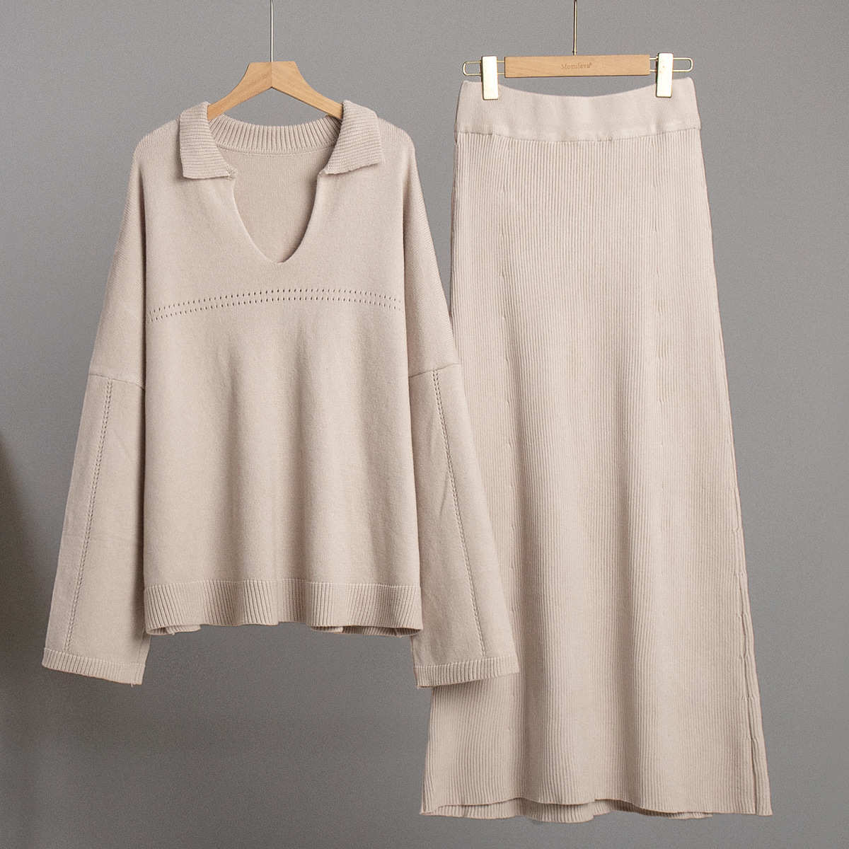 Conjunto de punto transfronterizo Europa y los Estados Unidos 2025 invierno nuevo estilo de moda minimalista viento suéter de punto de cuello V conjunto de falda de busto