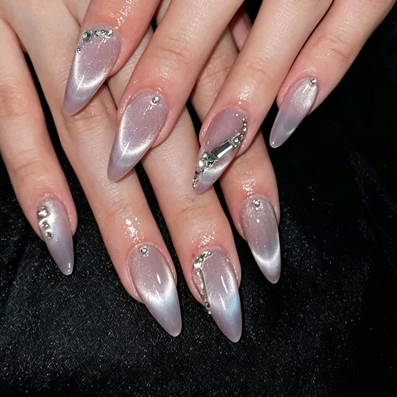Medium-length almond-shaped fake nails with multiple diamonds, glitter, light purple hollow design, cute, sweet, cool, elegant, trendy European and American style, popular across borders Medium-length almond-shaped fake nails with multiple diamonds, glitter, light purple hollow design, cute, sweet, cool, elegant, trendy European and American style, popular across borders