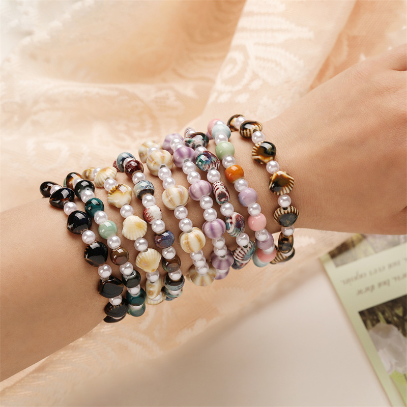 Creativo nuevo estilo de cerámica concha de sandía cuentas de color pulsera de cuentas redondas perla de imitación pulsera de cuentas de cerámica spot al por mayor