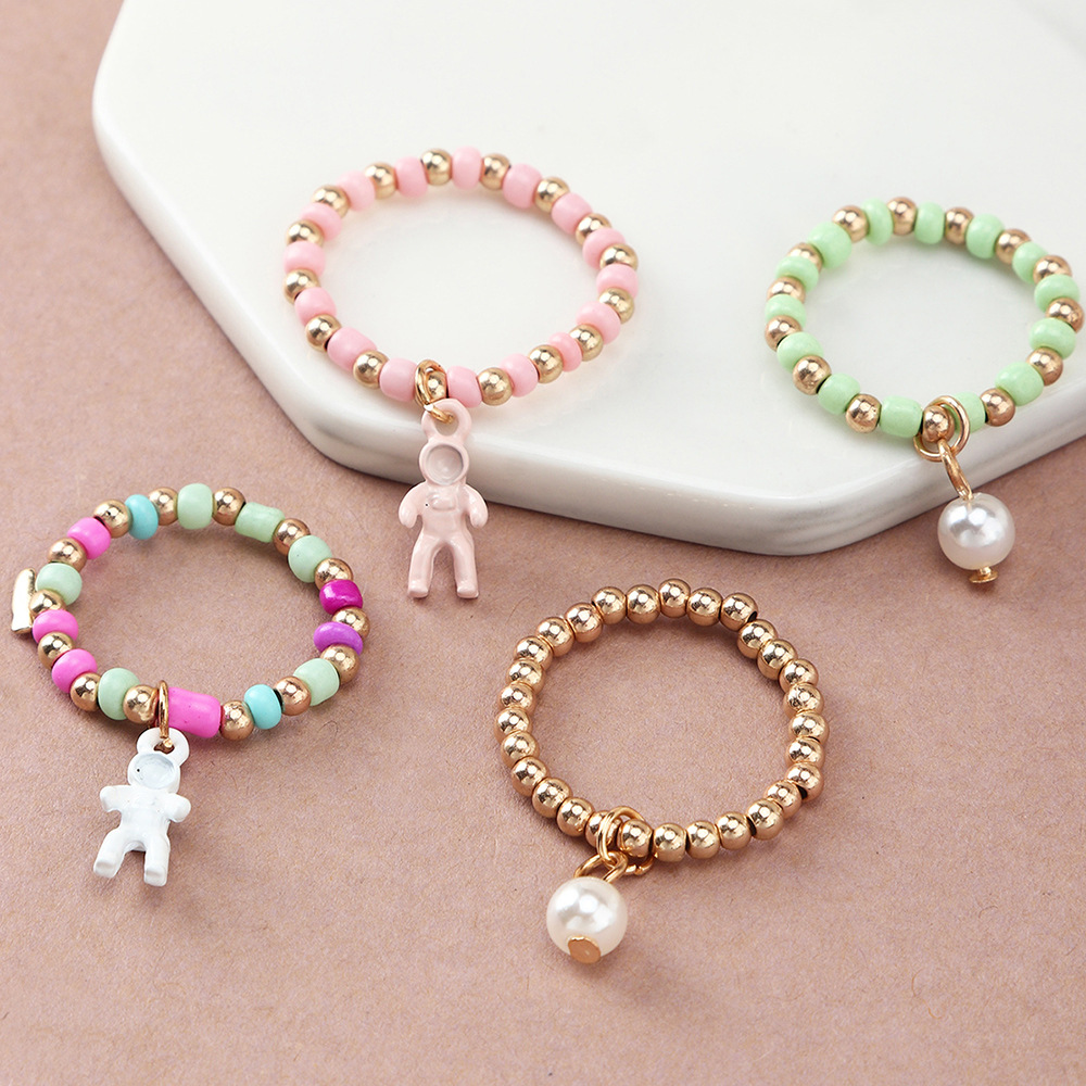 Simple Creative Spaceman Ring Color Rice Bead Elastic Tail Ring Set Ring display picture 4