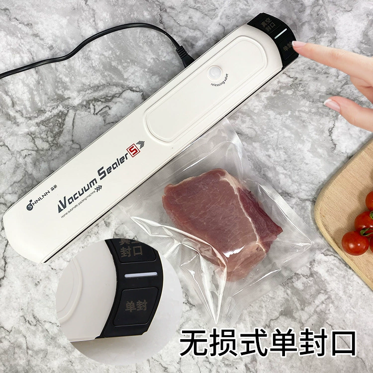 The kitchen fully automatic home multi -purpose food packaging machine vacuum sealing machine small compressed food preservation machine