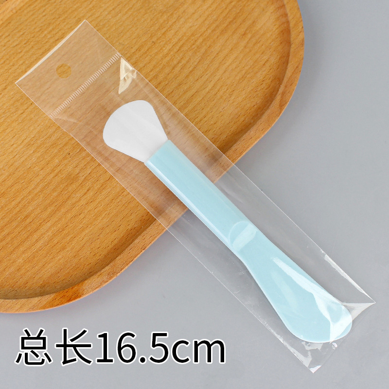 Large double-headed long-handled brush, fan-shaped, lake blue.