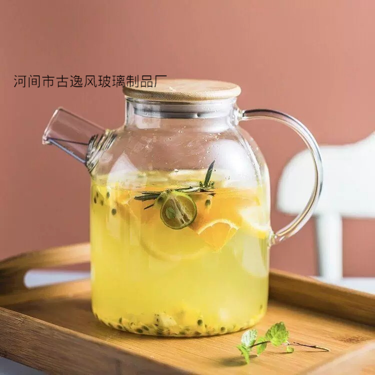 Tetera de vidrio gruesa resistente al calor Tetera pequeña resistente a altas temperaturas Tetera de flores con filtro de acero inoxidable Juego de té para el hogar