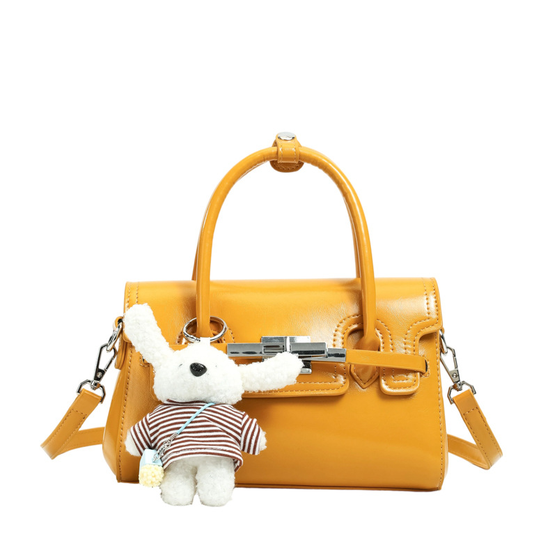 Bolso cuadrado pequeño exquisito, bolso de mano simple, 2026 nuevo tipo de tela, bolso de hombro de mujer, sensación diaria, bolso de hombro universal