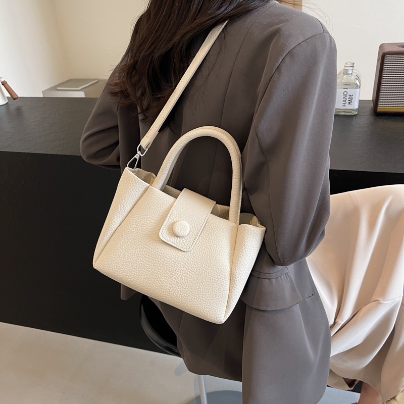 Bolso de mano de comercio exterior para mujeres 2025 nuevo tipo de bolso de mochila simple casual de moda versátil de alta calidad bolso de cubo de hombro