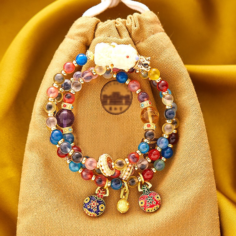 금을 삼키는 두 개의 원의 짐승 다채로운 설탕 녹색 어머니