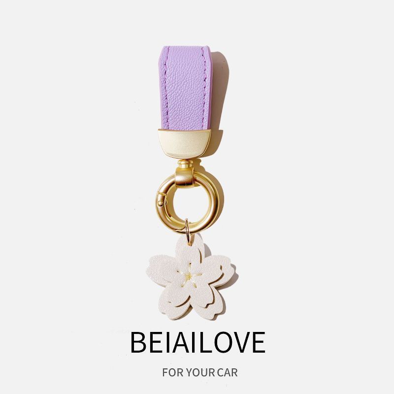 Estilo francés de alta gama de cuero fresco cuerda coche llavero simple lindo clave colgante Pequeño Libro Rojo mismo estilo girasol