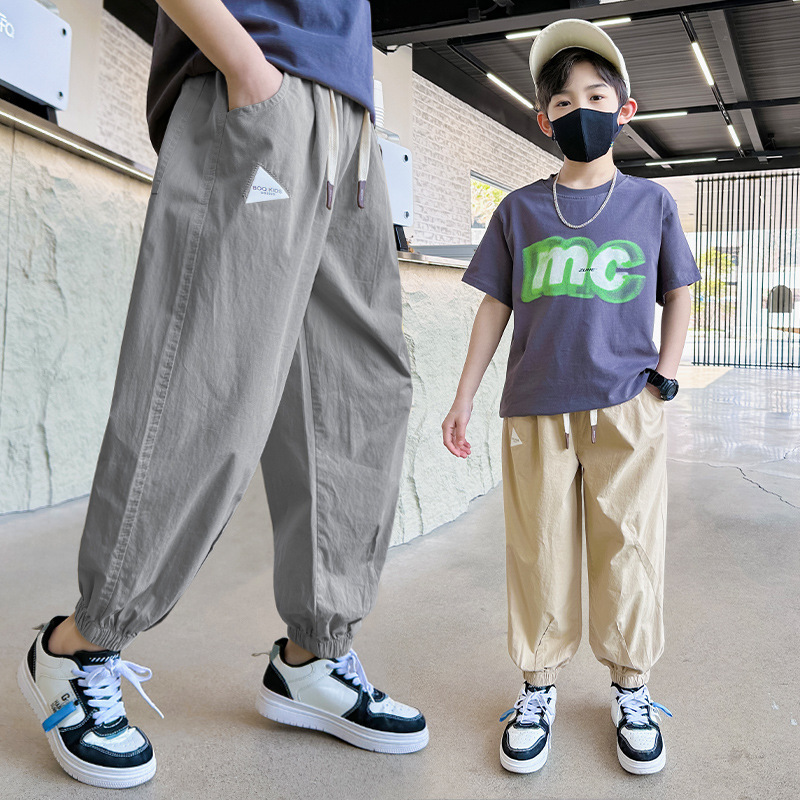 Z932早阳童2024春夏季新款中大童轻薄透气时髦印花贴标休闲裤男童