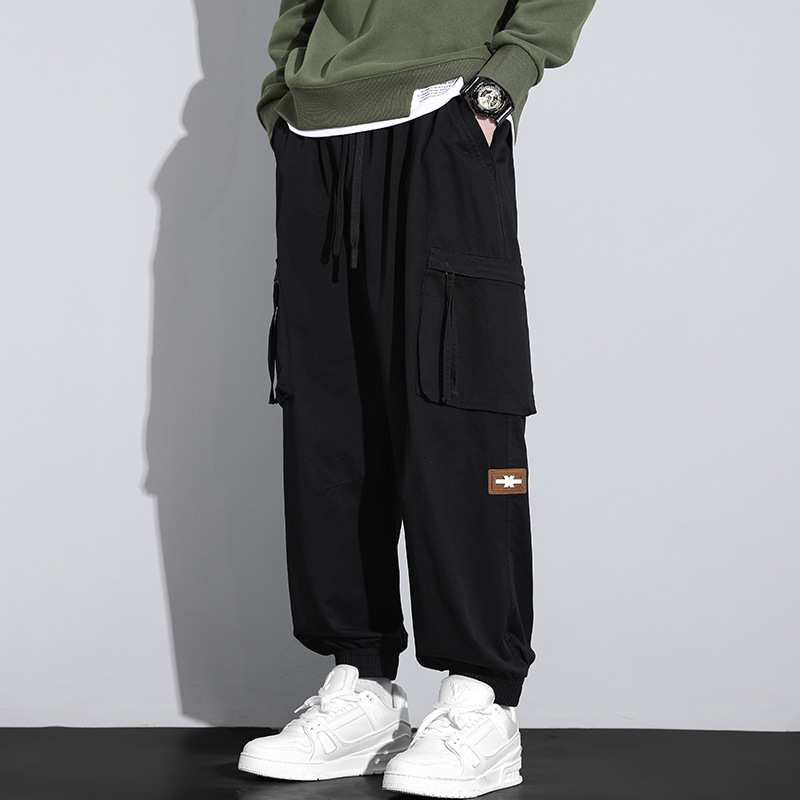 Nuevos pantalones de trabajo de alta calidad de primavera para hombres, moda multibolsillos con tendencia universal