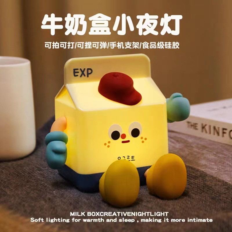 E-Commerce caja de leche caliente luz de la noche de dibujos animados lindo teléfono móvil titular de carga regalo de cumpleaños regalo creativo luz de la noche
