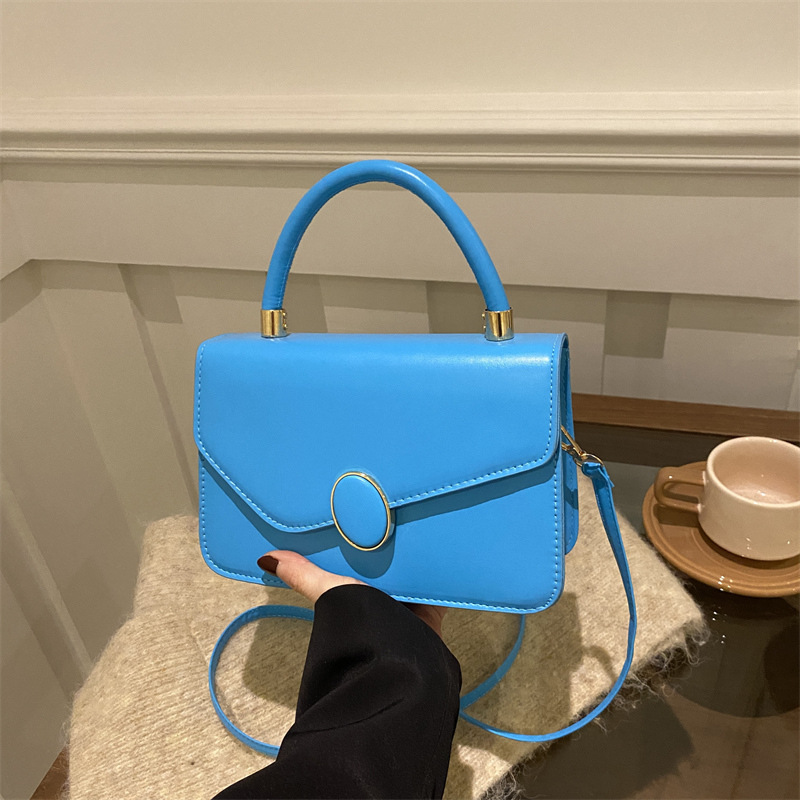 2025 primavera nuevo estilo simple y popular bolso de hombro coreano de color sólido simple bolso de literatura y arte para mujeres
