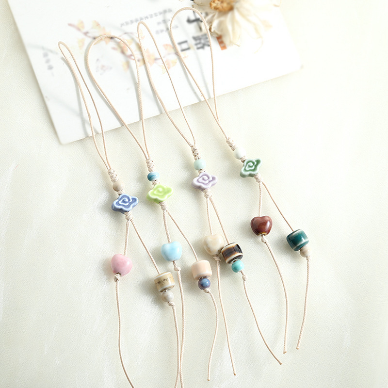 New fresh and simple ceramic cloud pattern phone chain DIY phone case pendant for women, niche versatile handmade woven lanyard