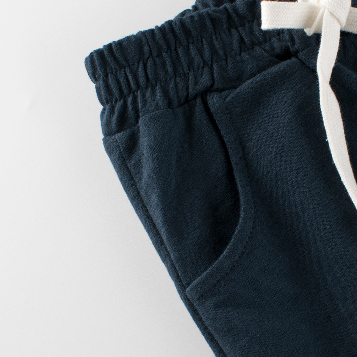 27kids ropa para niños coreanos 2025 verano nuevo estilo para hombres y bebés pantalones cortos para niños de cinco puntos de color sólido