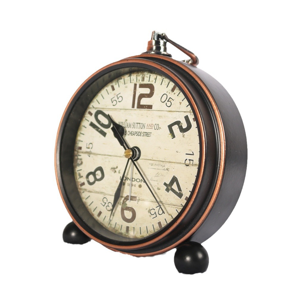 Reloj de hierro retro de estilo europeo alarma creativa Borde de bronce reloj de escritorio mudo negro reloj de asiento venta directa de fábrica al por mayor