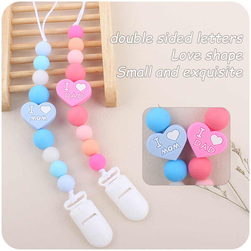 Bebé de dibujos animados amor dos lados mamá papá silicona mordedor calmante bebé chupete cadena a prueba de mordedura