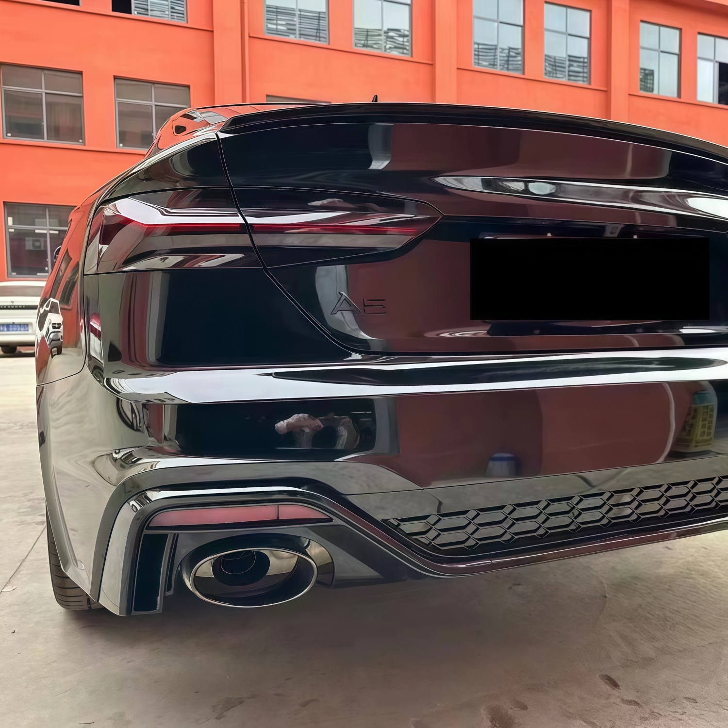 Suitable for Audi A5 2021-2024 models, RS5 rear bumper assembly, rear surround, tail lip, tail throat, and rear lower skirt, in a black finish