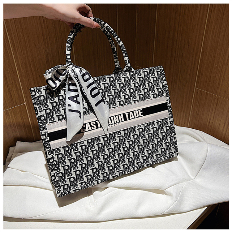 Bolsa de mano tipo satchel al por mayor de Baigou para mujer 2025 nueva moda europea y americana con letras impresas de gran capacidad.