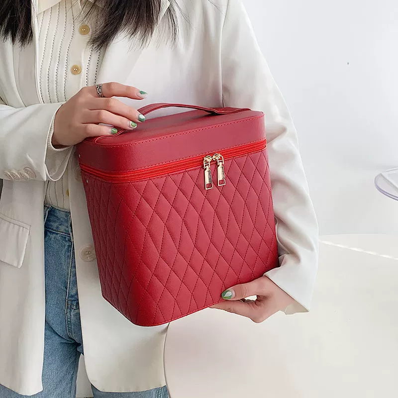 Capacious handheld cosmetic bag for traveling, storage box
