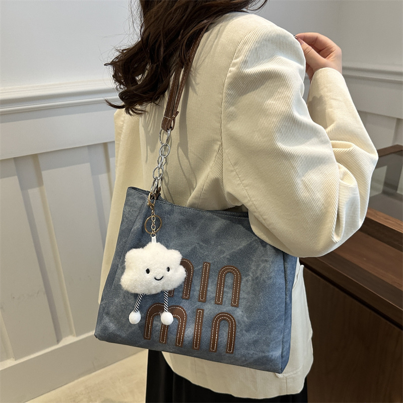 Bolsa de viaje de ocio para mujeres 2024 nueva bolsa de compras de hombro de textura simple de otoño y invierno