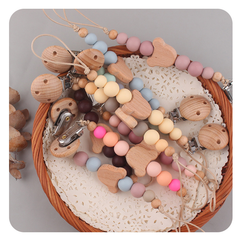 Productos para bebés Clip de chupete de madera de haya Dibujos animados de bebé creativo Oso de madera de haya Muerde los dientes Cadena de chupete anti-caída